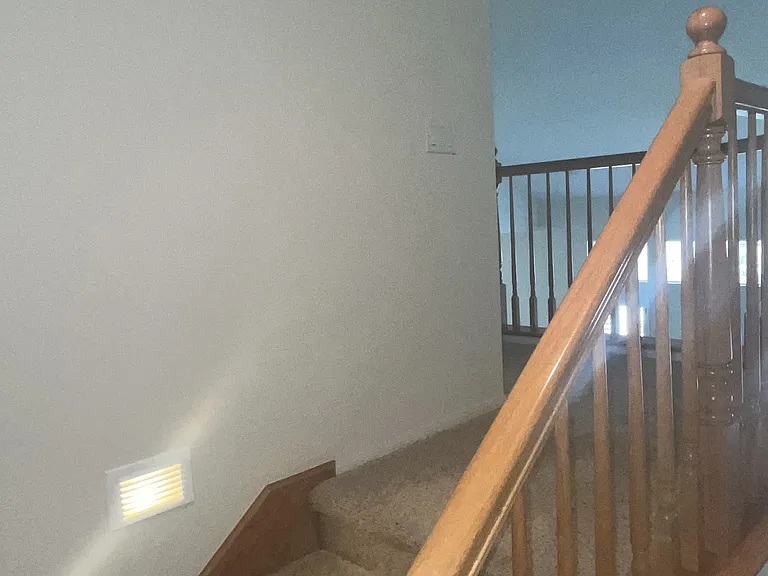 Stair case to up stairs bedroom and full bath