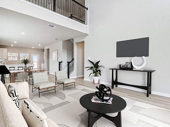 Virtually staged living room in the Medina floorplan at a Meritage Homes community.