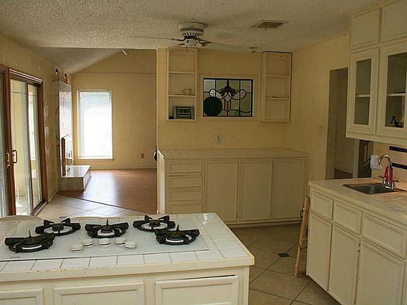 Kitchen alternate: Stained glass centerpiece over and accessible workstation and wet bar!