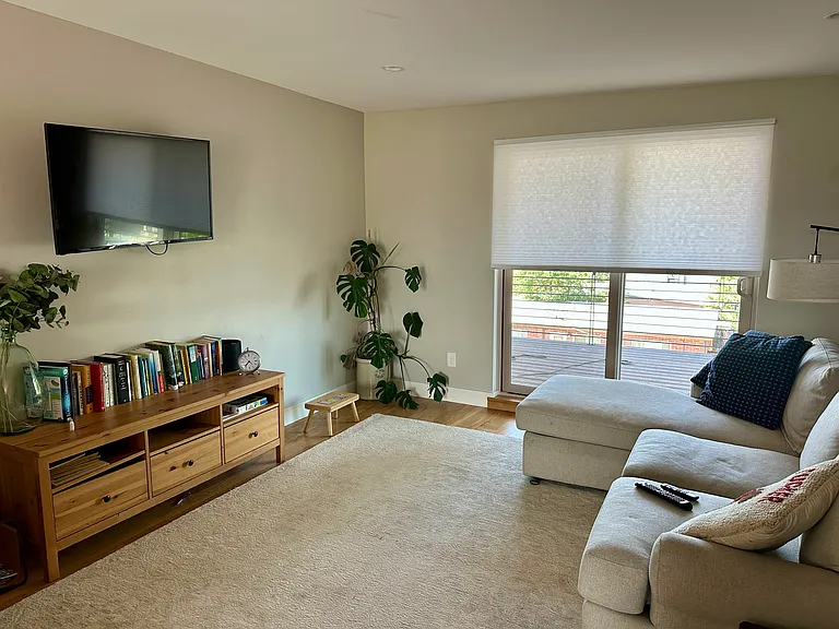 Third floor. Can be used as an extra living room, office, gym etc. 
This space has two decks, a powder bath and a wet bar.