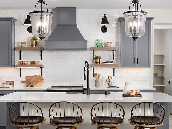 Full-height backsplash and floating shelves with undercabinet lighting