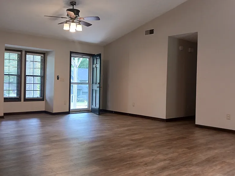 From kitchen, view to the front entrance. Open to large living area