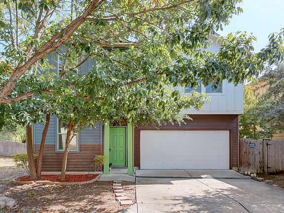 View of front of house with driveway and a garage