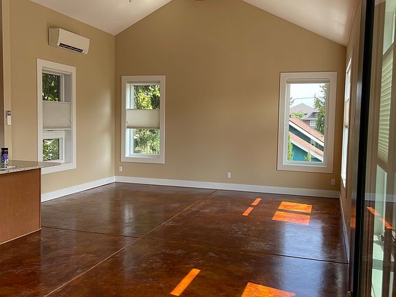 Living room from front door; kitchen at left