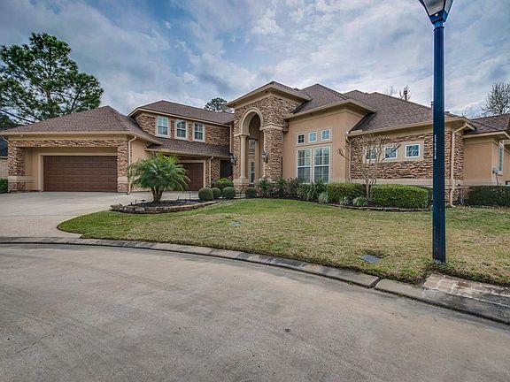 The custom home is nestled on a quiet cul-de-sac and backs up to the 8th hole of the golf course.