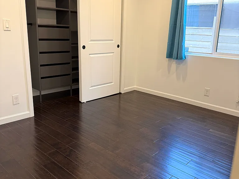 Bedroom 3 with dimmable recessed LED lighting.