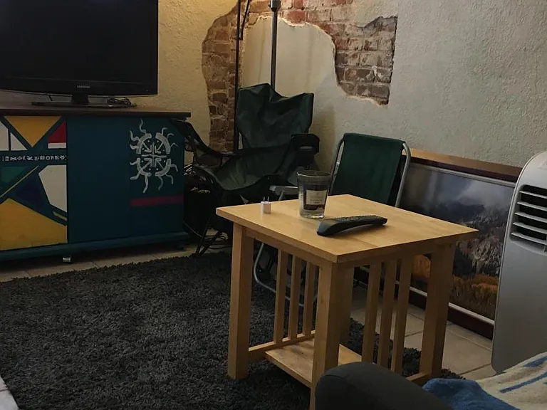 Cozy living room_window, exposed brick, tile floor