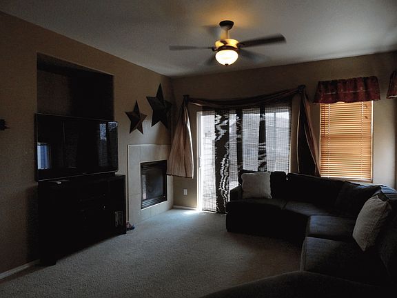 Gas Fireplace with sliding glass door to patio