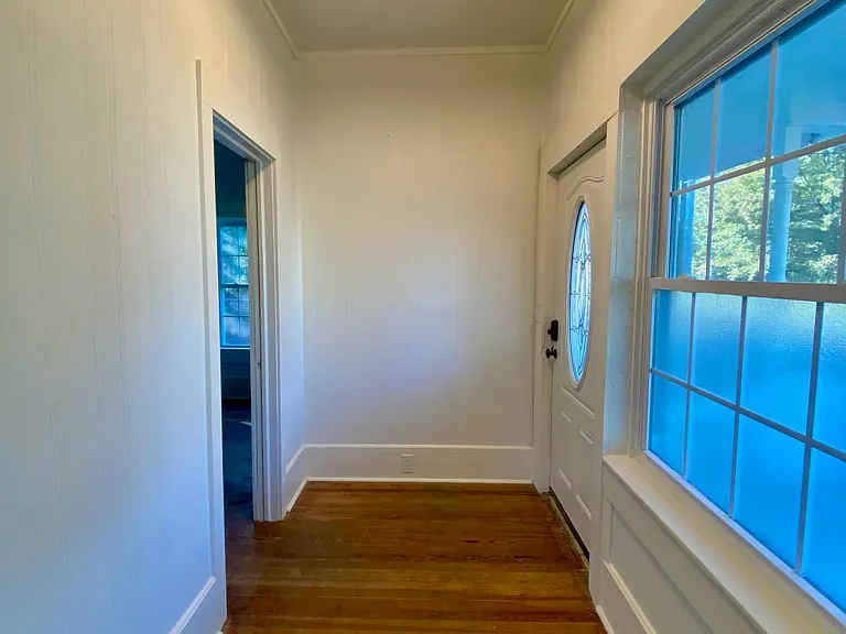Foyer - from the living room entrance. Bedroom entrance pictured to the left of photo.