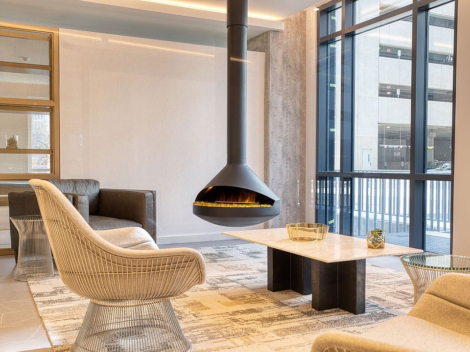 Welcome to Hamilton Crossing Apartments, where modern elegance meets cozy comfort. Enjoy our stylish lounge area, featuring a stunning hanging fireplace, perfect for relaxation or gatherings. Come see your new home today!