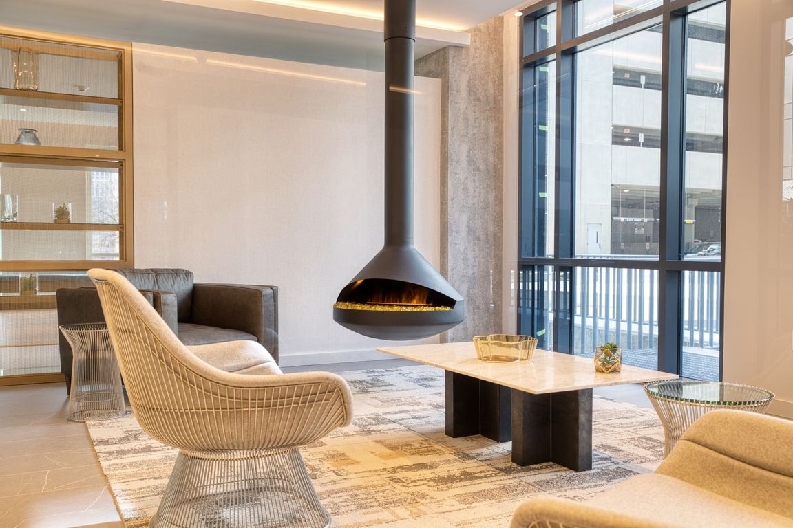 Welcome to Hamilton Crossing Apartments, where modern elegance meets cozy comfort. Enjoy our stylish lounge area, featuring a stunning hanging fireplace, perfect for relaxation or gatherings. Come see your new home today!