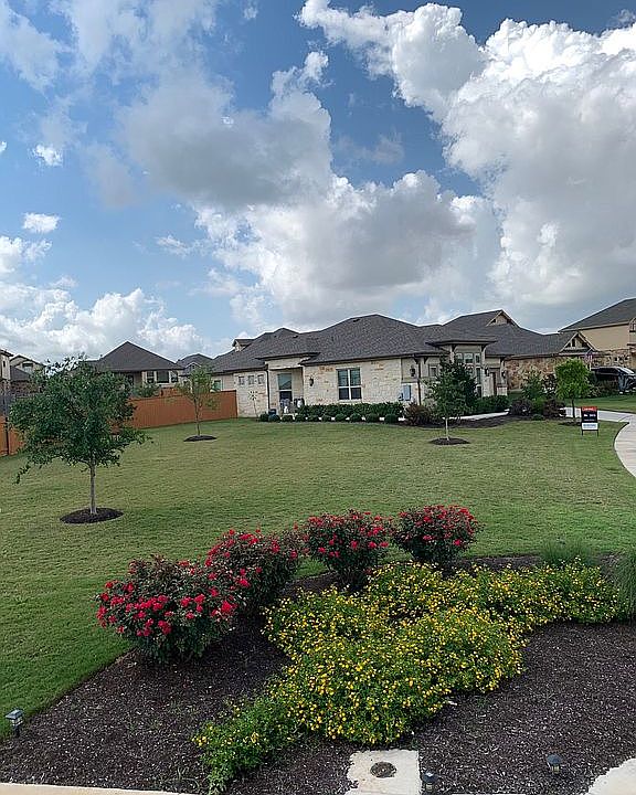 Lush, oversized front lawn