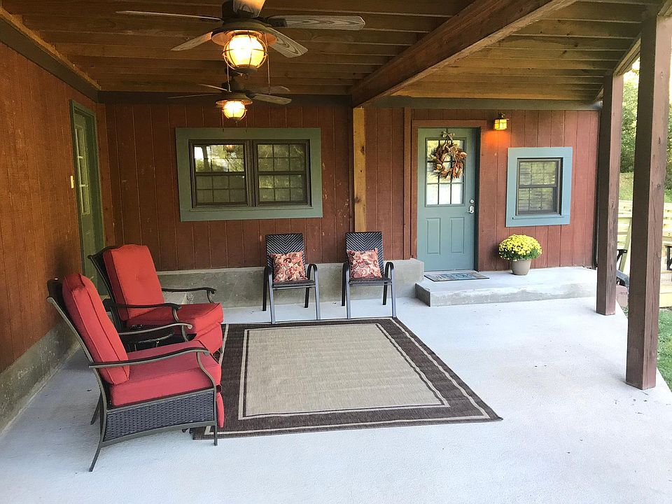 covered patio with ceiling fans