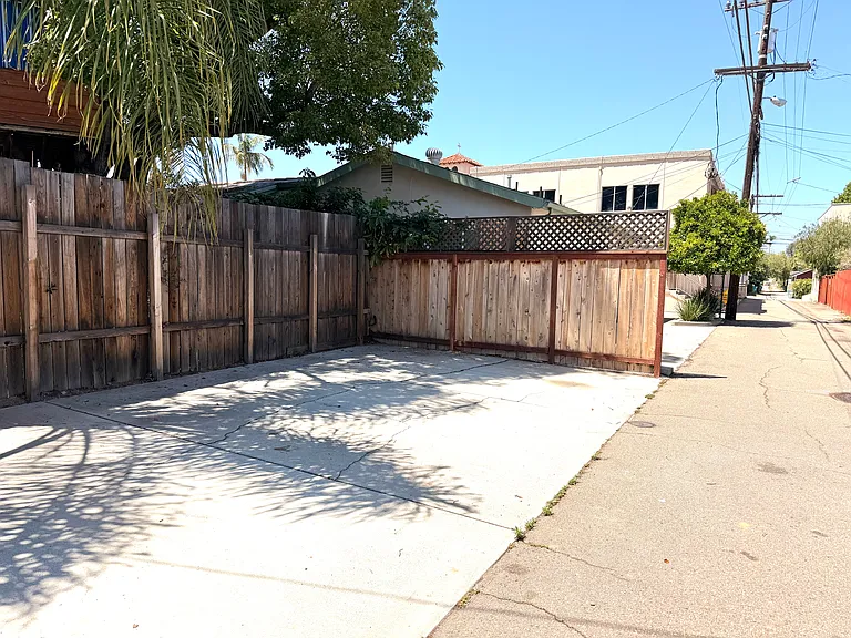 The apartment monthly rent includes one parking space (the middle spot), suitable for a compact to medium sized vehicle.