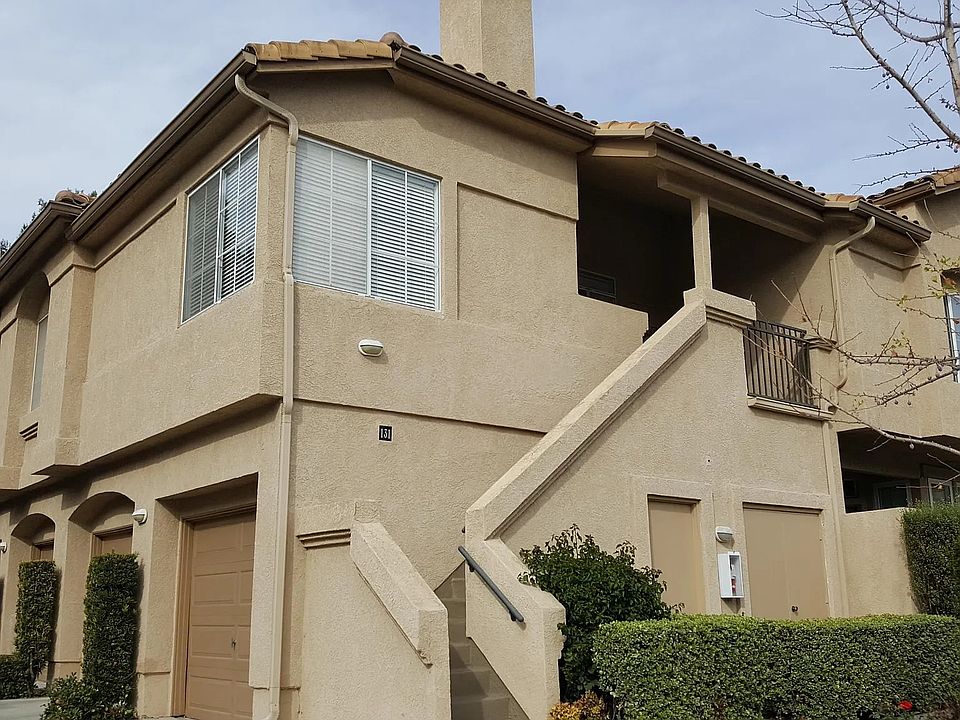 exterior view - the unit is on 2nd floor & the attached garage/laundry are on 1st floor