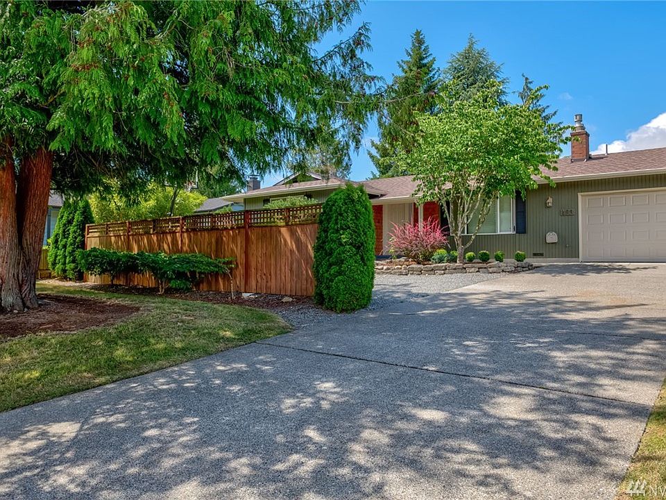 Wonderfully mature trees and landscaping with privacy and ample sized driveway!  