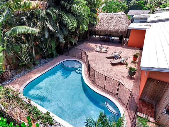 Enjoy a swim in your saltwater heated pool surrounded by tropical trees for ultimate relaxation and privacy!!