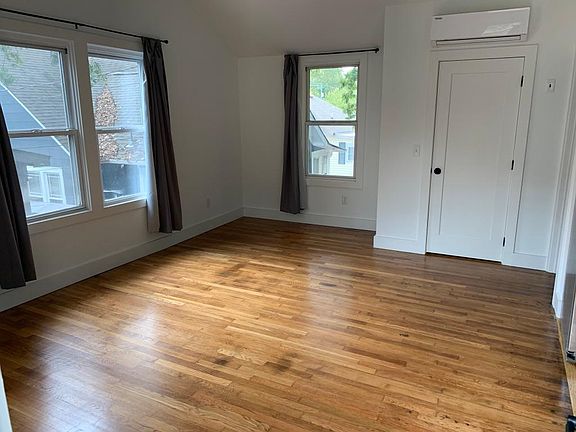 Living room with closet and new efficient split unit HVAC system. All new paint throughout.