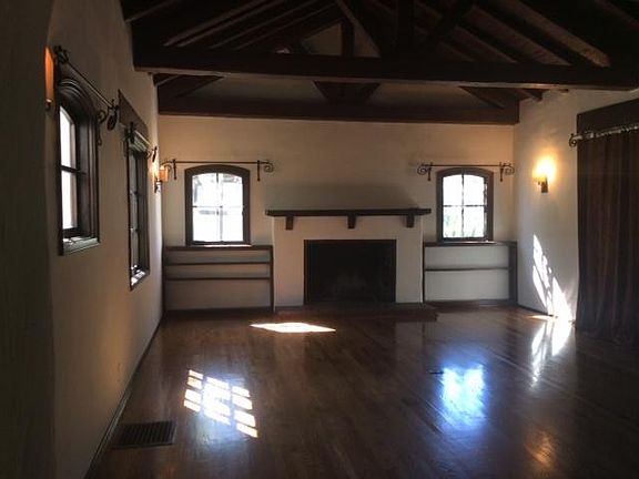 Living room, new wood floors, fire place, built in book shel