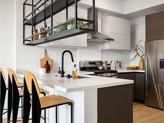 Hanging shelves make for a unique space divider in our one bedrooms