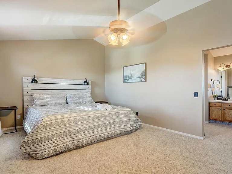 Master bedroom with a full bathroom
