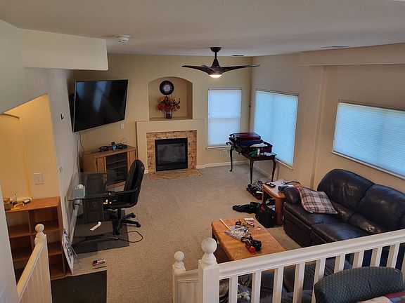 Family Room - new paint, windows, widow coverings, fan and carpet