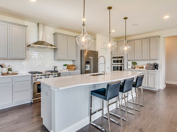 Gourmet Kitchen with Stylish Gray Cabinets and Crown Molding