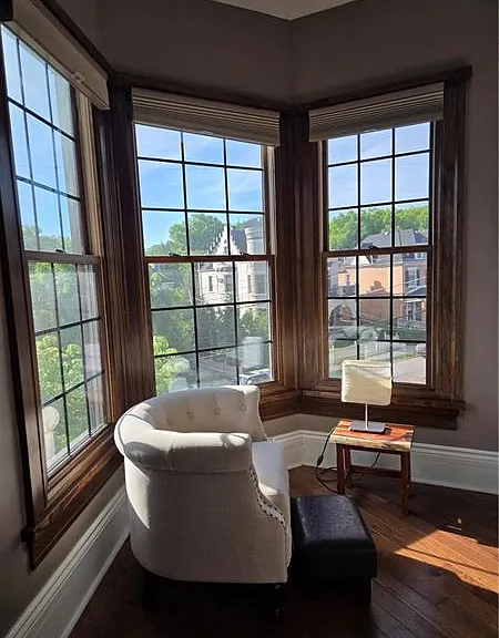 Sitting area in the primary bedroom, overlooking the beautiful scenary in Lang Ave