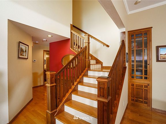 Beautiful custom staircase and built in display case.