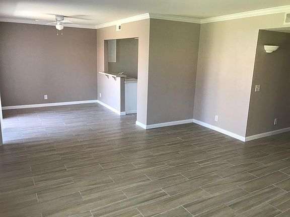 Great room from north west corner. Note baseboards and crown molding.