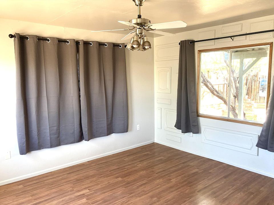 Living room has 3 large windows that will provide lots of light.