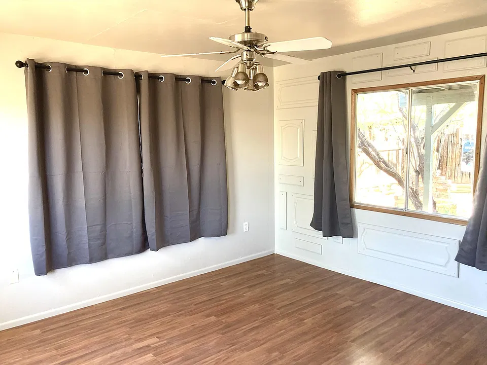 Living room has 3 large windows that will provide lots of light.