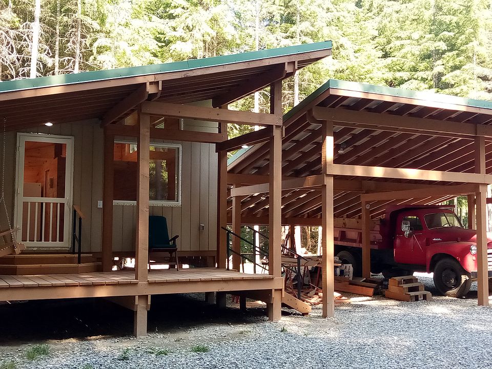 Private carport and 160 sq. ft. covered porch with swing, motion sensor lights. VERY private and quite. Completely removed from subburbia.