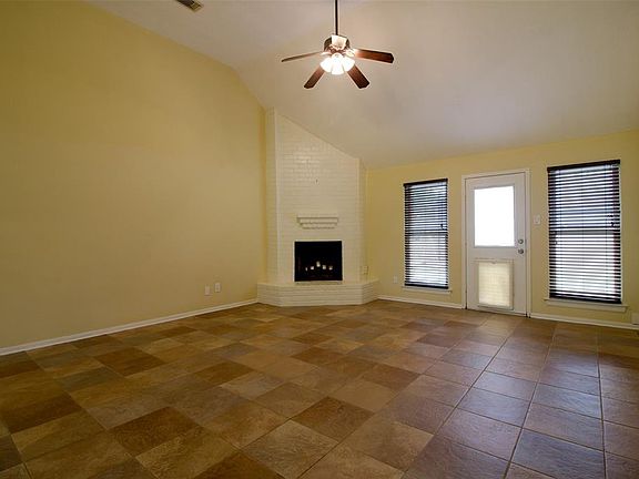 Spacious family room w/wood burning fireplace.