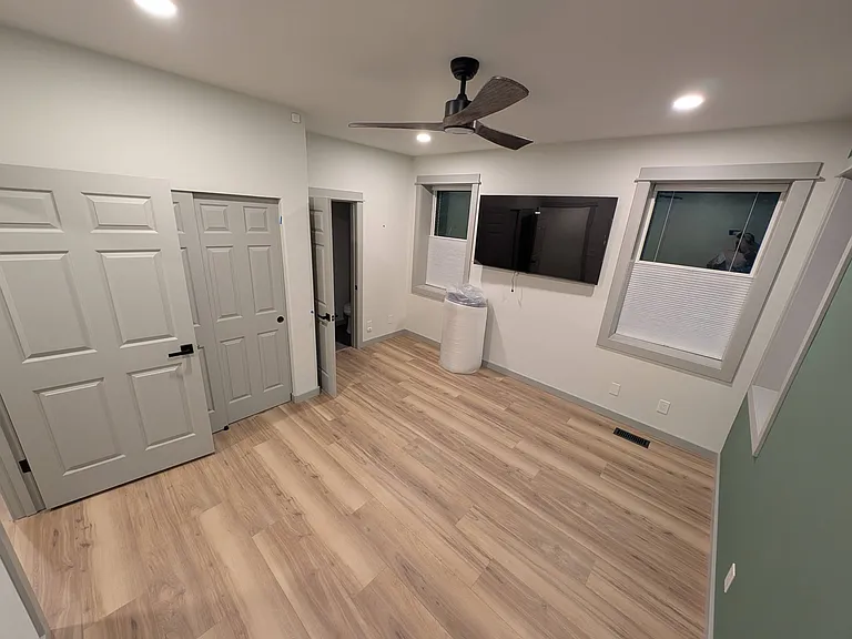 The available bedroom. Closet is behind the open door and ensuite bathroom door is straight ahead.