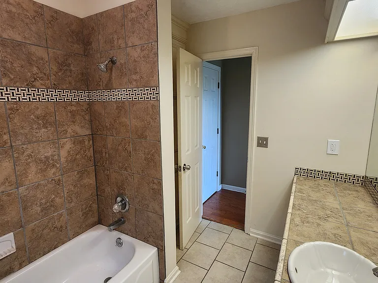 2nd Bathroom, tile countertops and flooring