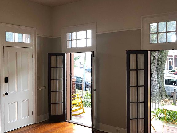 Front bedroom. The main entrance is white door with coded front lock.