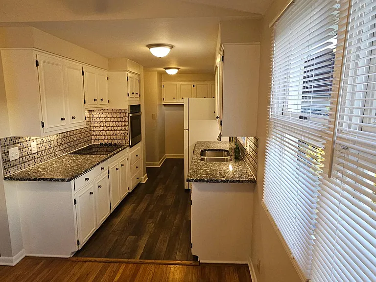 Kitchen with new Oven and Dishwasher.