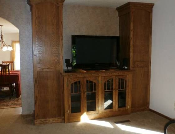 This custom built-in entertainment center was lovingly crafted by the home owner!