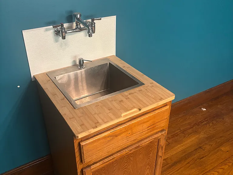 butcher block top bar sink in dining room
