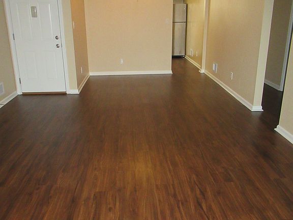 Living & Dining Rm: Facing Apt Entry Door & Dining Area & Kitchen Entry