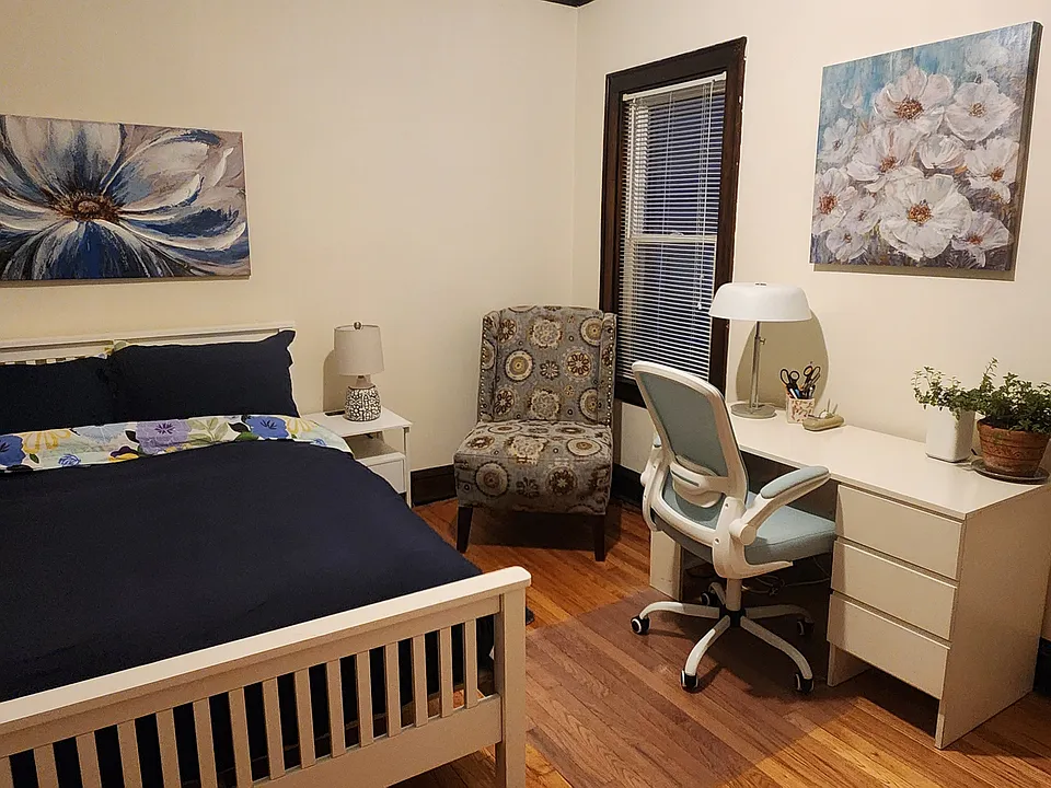 Second Bedroom with new full-sized Purple mattress bed, desk, chair, cabinet, nightstand, two lamps, an accent chair, rug, artwork and large closet.
