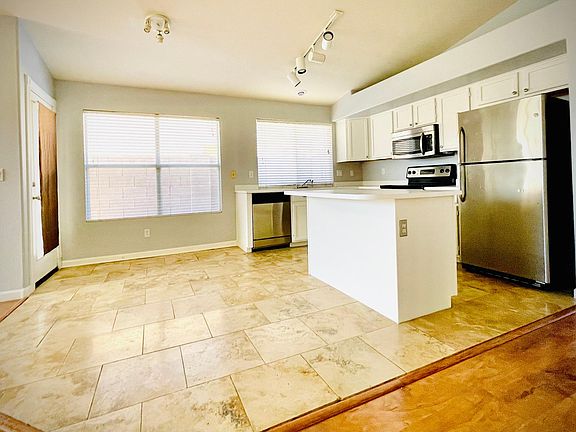 Stainless steel appliances and recently painted cabinets