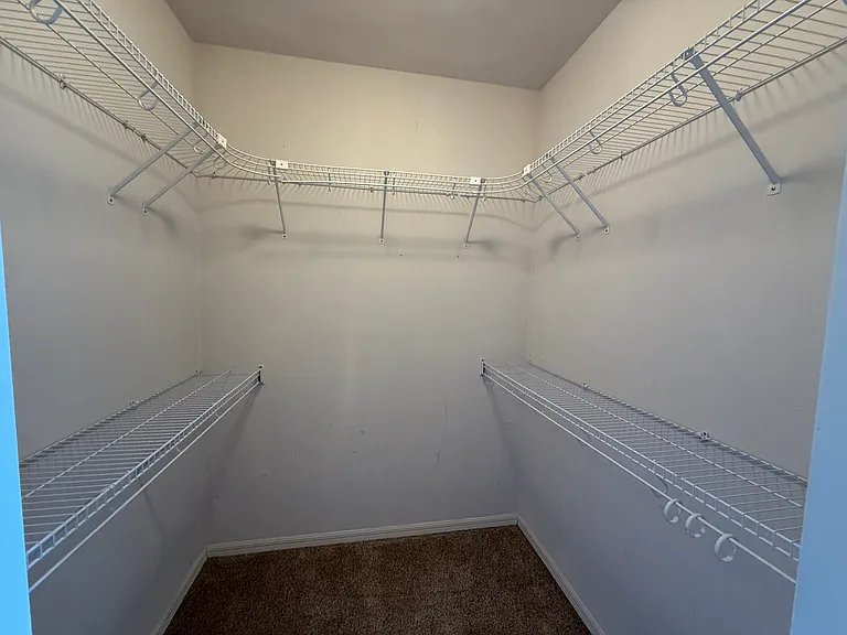 Large walk-in closet in master bedroom suite