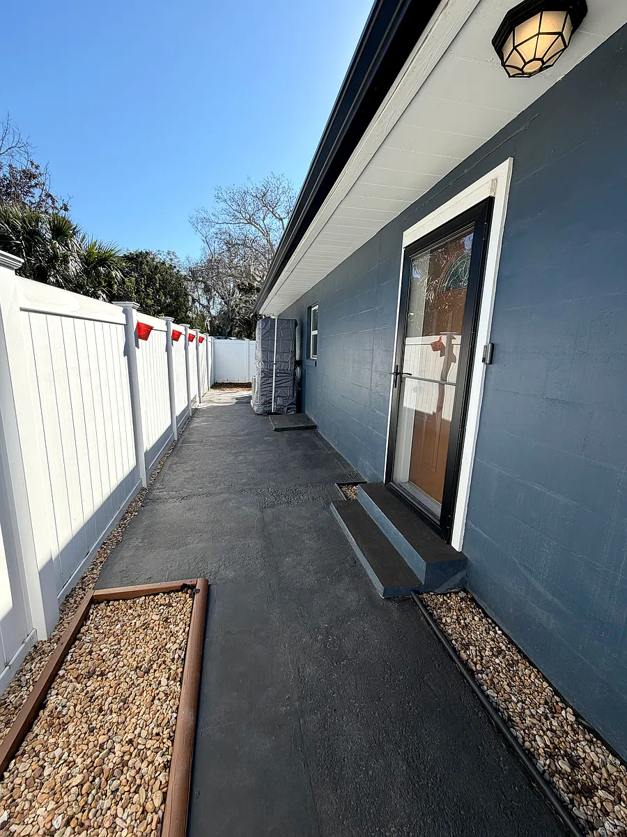 Includes a welcoming main entrance and a spacious patio area for relaxing or entertaining. - 5598 Myakka Ave
