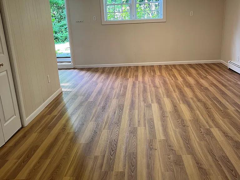 View from bedroom towards living area and windows