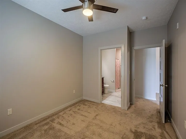 Carpet in a bedroom at Avenue 204.