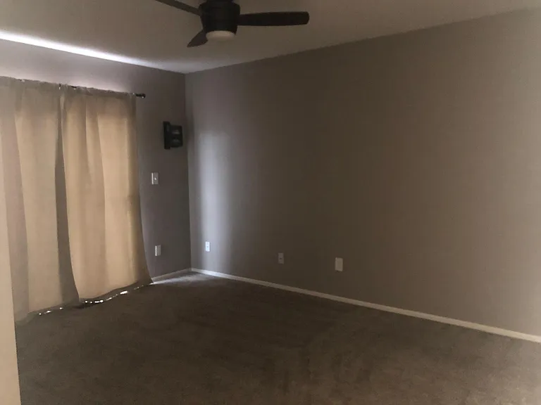 Upstairs Main Bedroom and Two Mirrored Closets with Sliding Glass Door Egress and Private Patio.