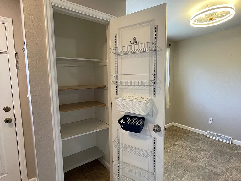 Pantry closet off kitchen.