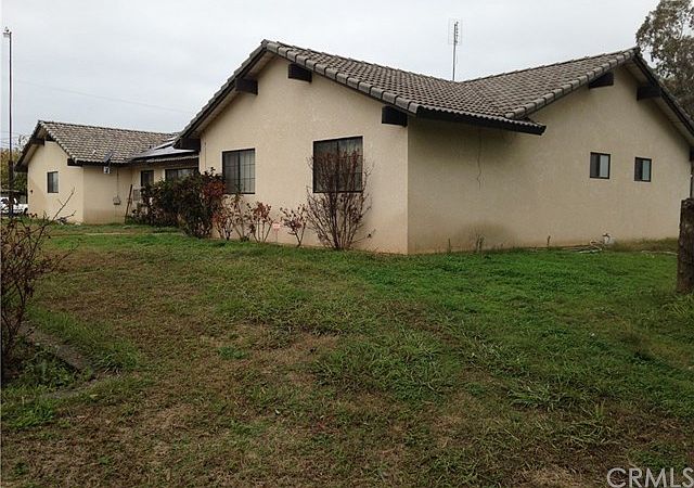 Front Of House with Tile Roof and part of the Solar System visible